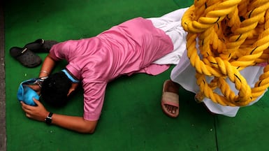 A devotee prays during Rath Yatra or the Chariot Journey Festival, in Kolkata, India. EPA