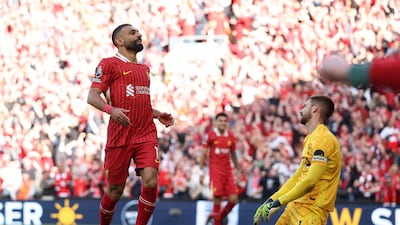 Liverpool's Mohamed Salah after scoring his team's fourth goal as Guglielmo Vicario of Tottenham Hotspur looks. Getty Images