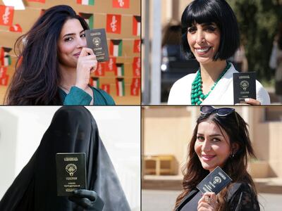 Women show their passports as they arrive to vote in parliamentary elections at a polling station in Kuwait City, on Thursday. AFP