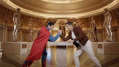 Ryan Reynolds takes on Superman in an arm wrestling match at Warner Bros World Abu Dhabi. Photo: Yas Island / Miral