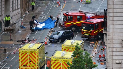 A child and adult were seriously hurt and dozens more injured after car ploughed into the crowd. Reuters